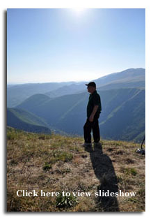 Pietro alone on a mountaintop.