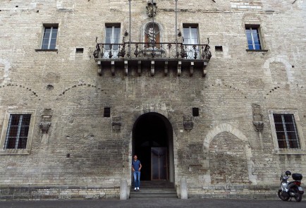 Marco Valeri stands in the doorway of City Hall in Cagli, Italy.